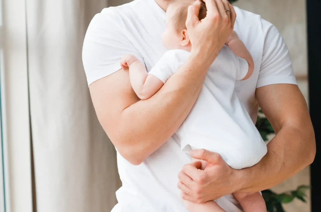 Father Standing Holding Baby (1)