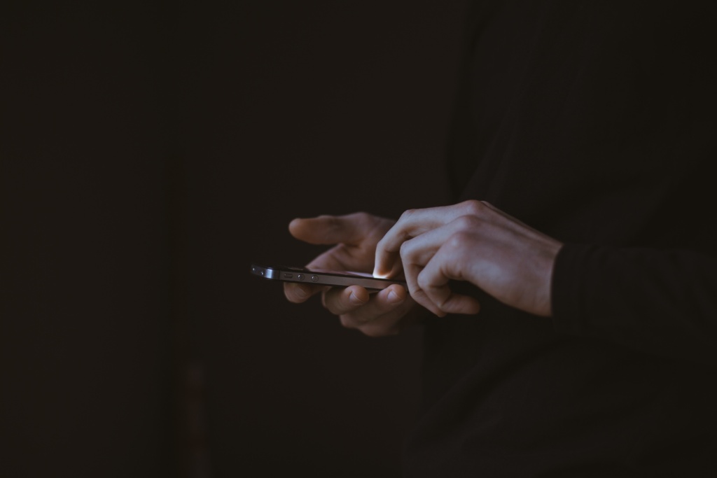 A Person Holding Their Phone