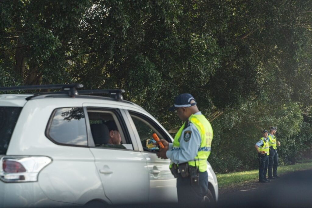 Police Officer Drug Testing On The Side Of The Road