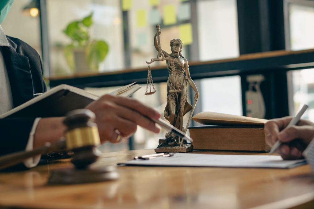 Statue Of Justice On A Desk, Representing The Review Of Strangulation Laws In Queensland