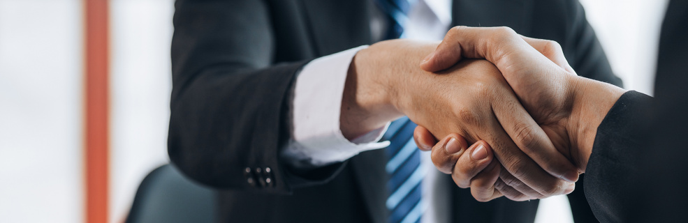Criminal Lawyer Shaking Hands With Client After Agreeing To Take On Their Making Child Exploitation Material Case.